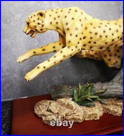 A Border Fine Arts Wild World figure Running Cheetah's Signed G. A